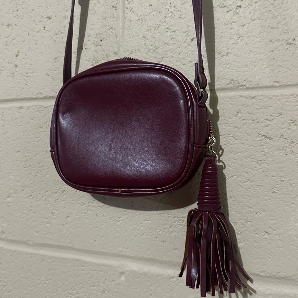 FOREVER 21 crossbody purse bag with tassel. Burgundy / maroon color